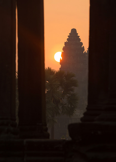 Hazy Angkor Sunrise through Library Pillars